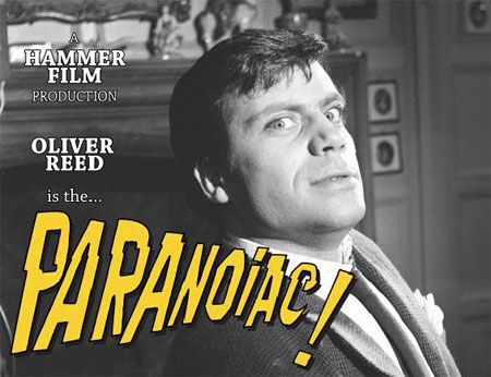 Oliver Reed in Paranoic, looking at camera weirdly